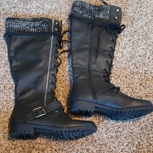 Knee high combat boots.